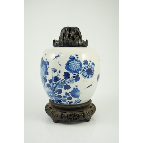 138 - A Chinese blue and white birds and rockwork ovoid jar, Kangxi period, painted with three birds in ... 