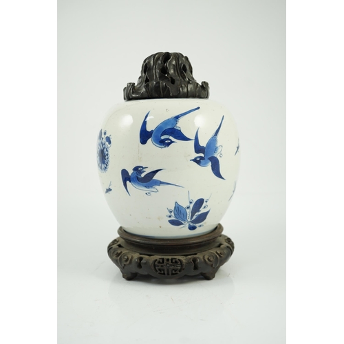 138 - A Chinese blue and white birds and rockwork ovoid jar, Kangxi period, painted with three birds in ... 