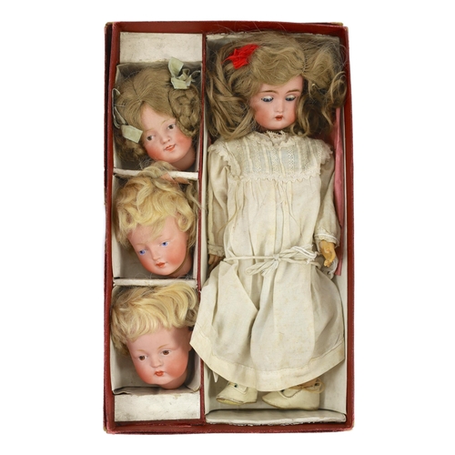 14 - A rare J. D. Kestner bisque character doll, with three interchangeable character heads, German, circ... 