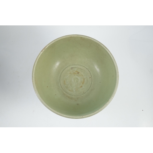 143 - A Chinese Ming Longquan celadon bowl, 15th century, the interior moulded to the centre with a flower... 