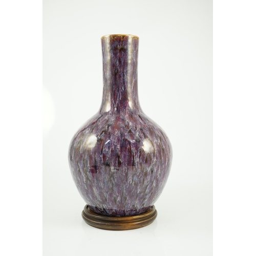 145 - A large Chinese flambé-glazed bottle vase, tianqiuping, 18th/19th century, covered in a thick purple... 