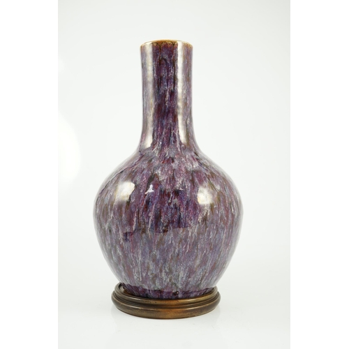 145 - A large Chinese flambé-glazed bottle vase, tianqiuping, 18th/19th century, covered in a thick purple... 