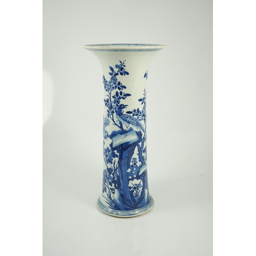 148 - A tall Chinese blue and white pheasants and rocks beaker vase, gu, Kangxi period, painted with phe... 