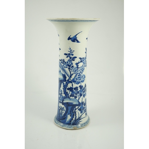 148 - A tall Chinese blue and white pheasants and rocks beaker vase, gu, Kangxi period, painted with phe... 