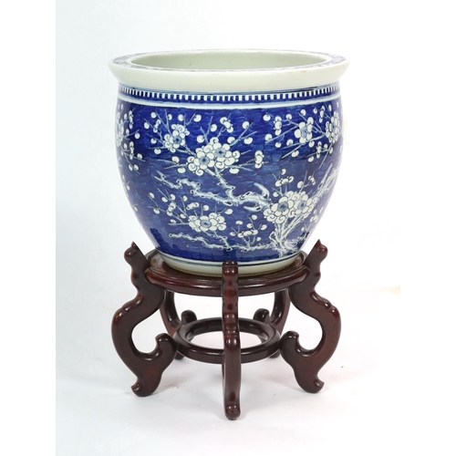 149 - A Chinese blue and white plum blossom jardiniere, 19th century, painted with plum blossom on gnarl... 