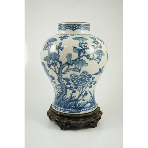 156 - A Chinese blue and white birds and blossom baluster vase, Kangxi period, painted with a continuous... 