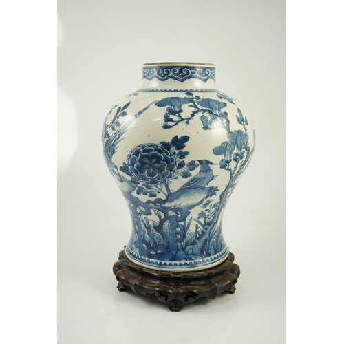 156 - A Chinese blue and white birds and blossom baluster vase, Kangxi period, painted with a continuous... 