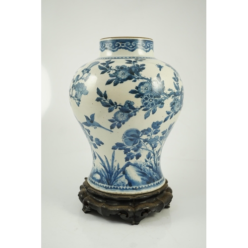 156 - A Chinese blue and white birds and blossom baluster vase, Kangxi period, painted with a continuous... 