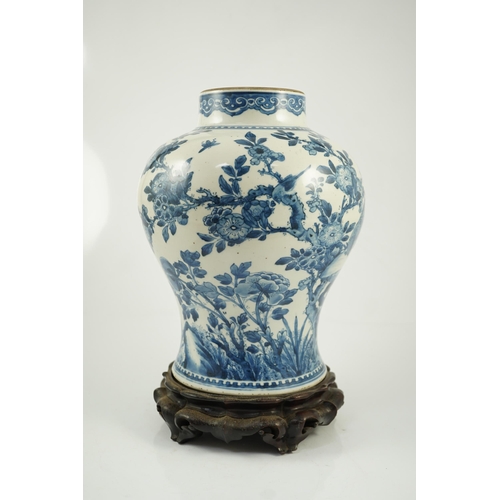 156 - A Chinese blue and white birds and blossom baluster vase, Kangxi period, painted with a continuous... 