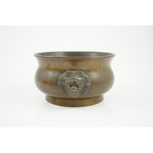 159 - A Chinese bronze censer, gui, 18th century, with olive-brown patina, cast with a pair of lion-mask h... 