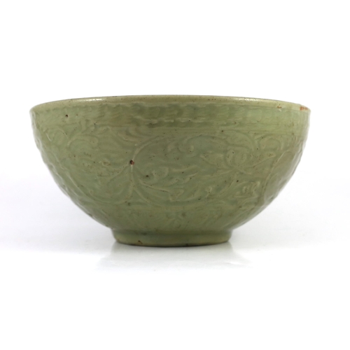 163 - A large Chinese Ming carved Longquan celadon deep bowl, first half 15th century, heavily potted, the... 