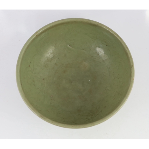 163 - A large Chinese Ming carved Longquan celadon deep bowl, first half 15th century, heavily potted, the... 