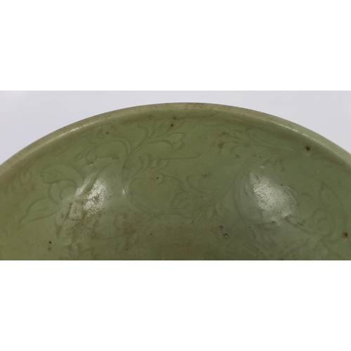 163 - A large Chinese Ming carved Longquan celadon deep bowl, first half 15th century, heavily potted, the... 