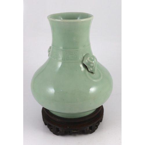 164 - A Chinese celadon glazed vase, hu, Qianlong seal mark and probably of the period (1736-1795), the ne... 