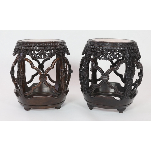 167 - A near pair of Chinese hongmu and rouge marble inset stools, late 19th century, each carved and pier... 