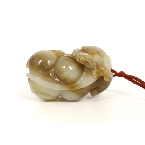 175 - A Chinese white and brown jade lion-dog carving, carved in the round with openwork head and limbs, 5... 