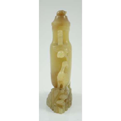 183 - A Chinese yellow and russet jade vase and cover, 19th/20th century, of flattened baluster shape, car... 