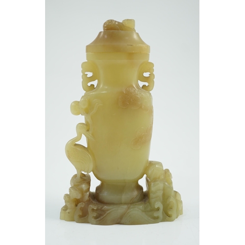 183 - A Chinese yellow and russet jade vase and cover, 19th/20th century, of flattened baluster shape, car... 