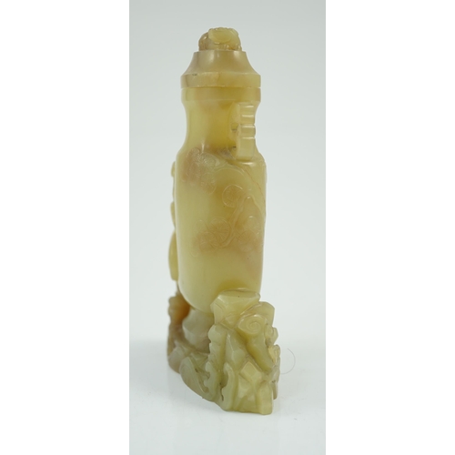 183 - A Chinese yellow and russet jade vase and cover, 19th/20th century, of flattened baluster shape, car... 