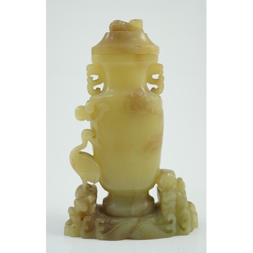 183 - A Chinese yellow and russet jade vase and cover, 19th/20th century, of flattened baluster shape, car... 