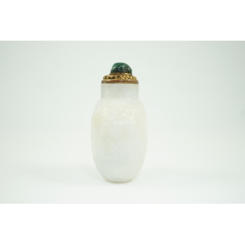 185 - A good Chinese archaistic white jade snuff bottle, 1780-1850, of flattened flask form, well hollowed... 