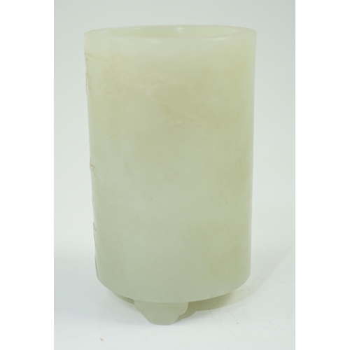 186 - A small Chinese pale celadon jade brushpot, 19th century, carved in relief with a blossoming plum tr... 