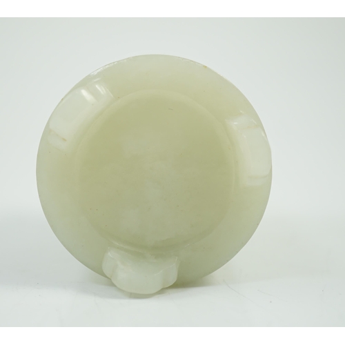 186 - A small Chinese pale celadon jade brushpot, 19th century, carved in relief with a blossoming plum tr... 