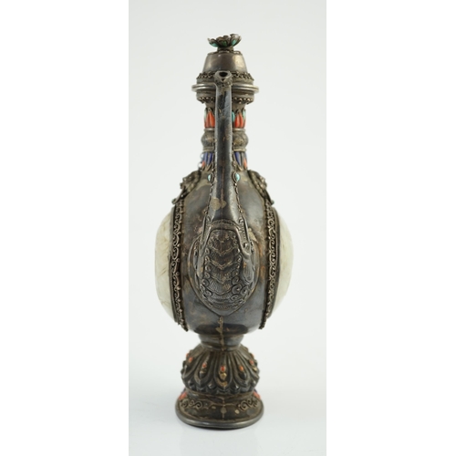 188 - A Tibetan silver, jade, coral and hardstone mounted ewer, late 19th century, the Chinese pale celado... 