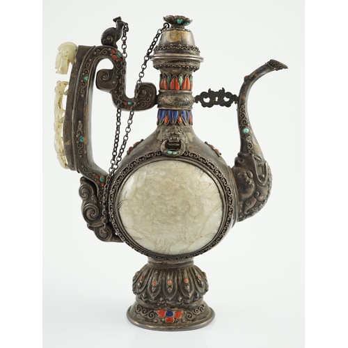 188 - A Tibetan silver, jade, coral and hardstone mounted ewer, late 19th century, the Chinese pale celado... 