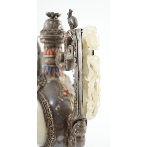 188 - A Tibetan silver, jade, coral and hardstone mounted ewer, late 19th century, the Chinese pale celado... 