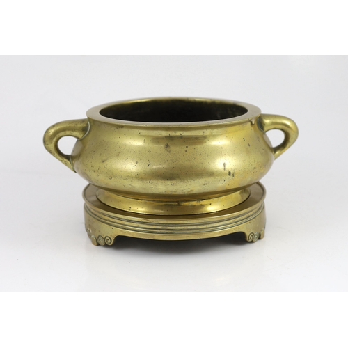 191 - A large Chinese polished bronze censer and stand, gui, Xuande mark, 18th century, the censer of bomb... 