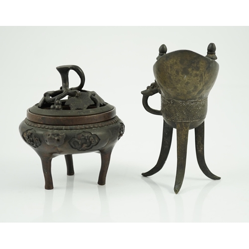 198 - A Chinese bronze and copper alloy tripod censer and cover and a Chinese archaistic bronze tripod ves... 