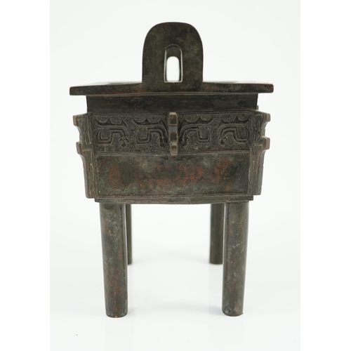 199 - A Chinese archaistic bronze vessel, fangding, 17th/18th century, cast and chased with a band of zoom... 