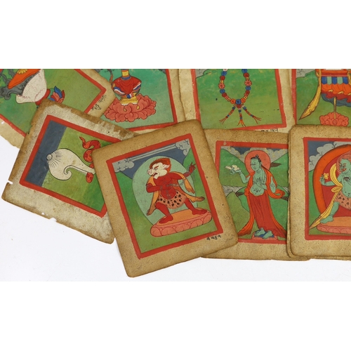 202 - A set of thirty six Tibetan painted thangka pages, 19th century, each depicting deities and inscribe... 