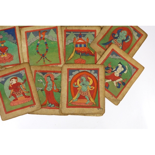 202 - A set of thirty six Tibetan painted thangka pages, 19th century, each depicting deities and inscribe... 