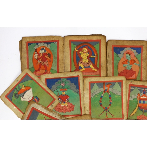 202 - A set of thirty six Tibetan painted thangka pages, 19th century, each depicting deities and inscribe... 