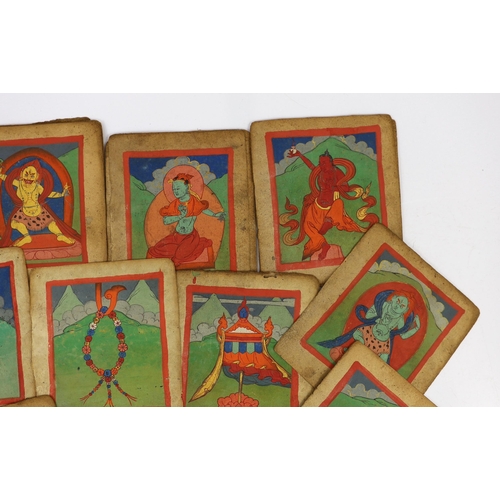 202 - A set of thirty six Tibetan painted thangka pages, 19th century, each depicting deities and inscribe... 