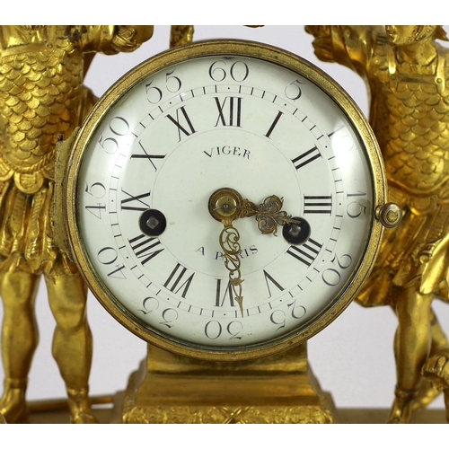 214 - Viger à Paris. A Louis XVI ormolu mantel clock, surmounted with the figures of a King holding a spea... 