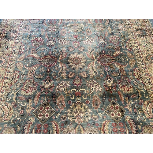 225 - An Indian Persian style sage green ground carpet, 465 x 363cm