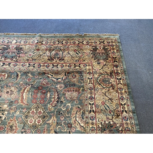 225 - An Indian Persian style sage green ground carpet, 465 x 363cm