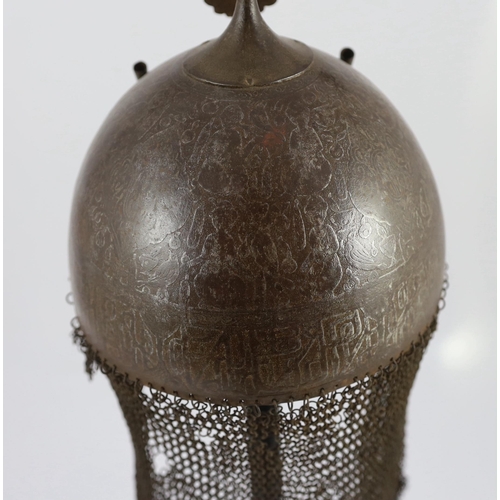 23 - A 19th century Persian Kulah Khud, with spike finial and silvered decoration including an inscriptio... 