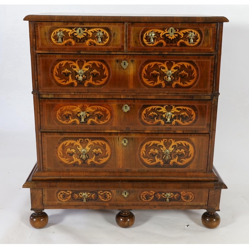 234 - A William III and later walnut and marquetry chest on stand, with quartered top centred with an oval... 