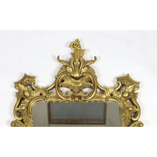 238 - A 19th century Chippendale style carved giltwood wall mirror, with foliate scroll frame and rectangu... 