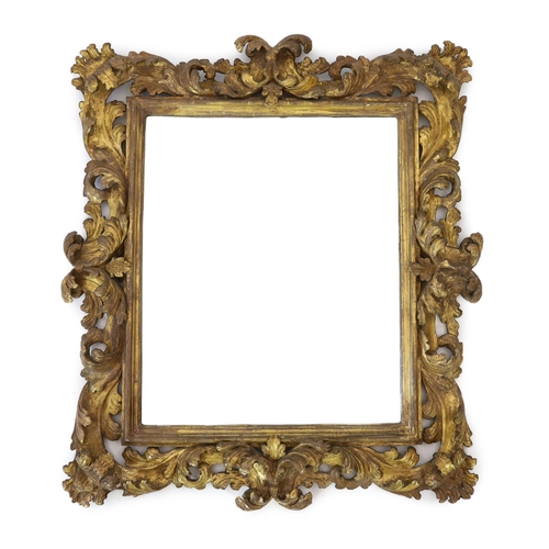 240 - A late 17th/early 18th century Florentine carved giltwood frame, with boldly carved scrolling leaves... 