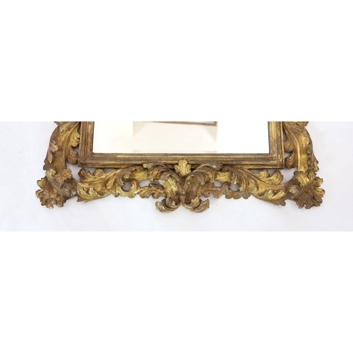 240 - A late 17th/early 18th century Florentine carved giltwood frame, with boldly carved scrolling leaves... 