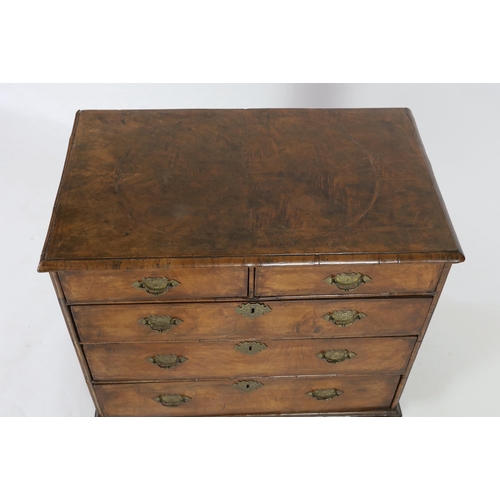 241 - A William and Mary walnut chest of drawers, c.1690, inlaid with feather banding, the segmented quart... 