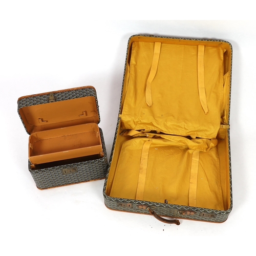 25 - A 1940's Goyard vanity case with matching suitcase, each with tan leather mounts, the vanity case wi... 