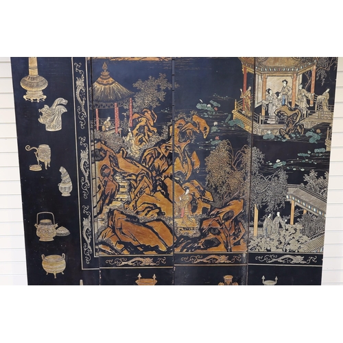 251 - A Chinese coromandel lacquer twelve panel screen, 19th century, decorated with fan shaped panels ove... 