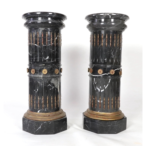 258 - A pair of ornate variegated green marble columns, the fluted stems inset with gilt harebell motifs a... 