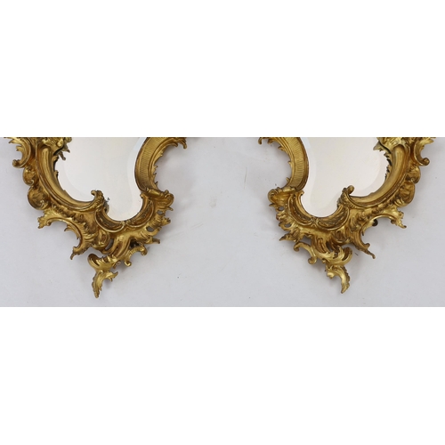 260 - A pair of 19th century carved giltwood wall mirrors in the Rococo style, of asymmetrical form with f... 